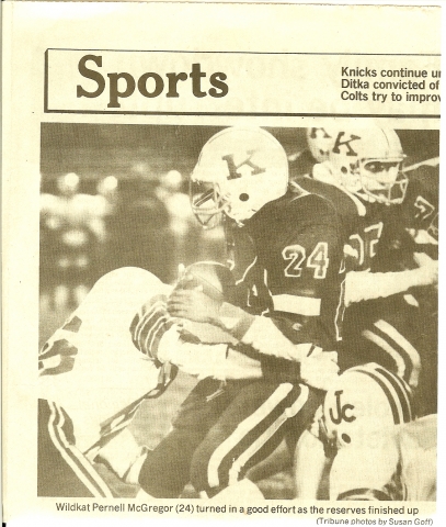 Photo of junior Pernell McGregor running the ball during the Section 4 Championship football game once the reserves were put in after the game vs. Jay County was in the bag for the Kats (Kokomo Trubune - 11/9/85).